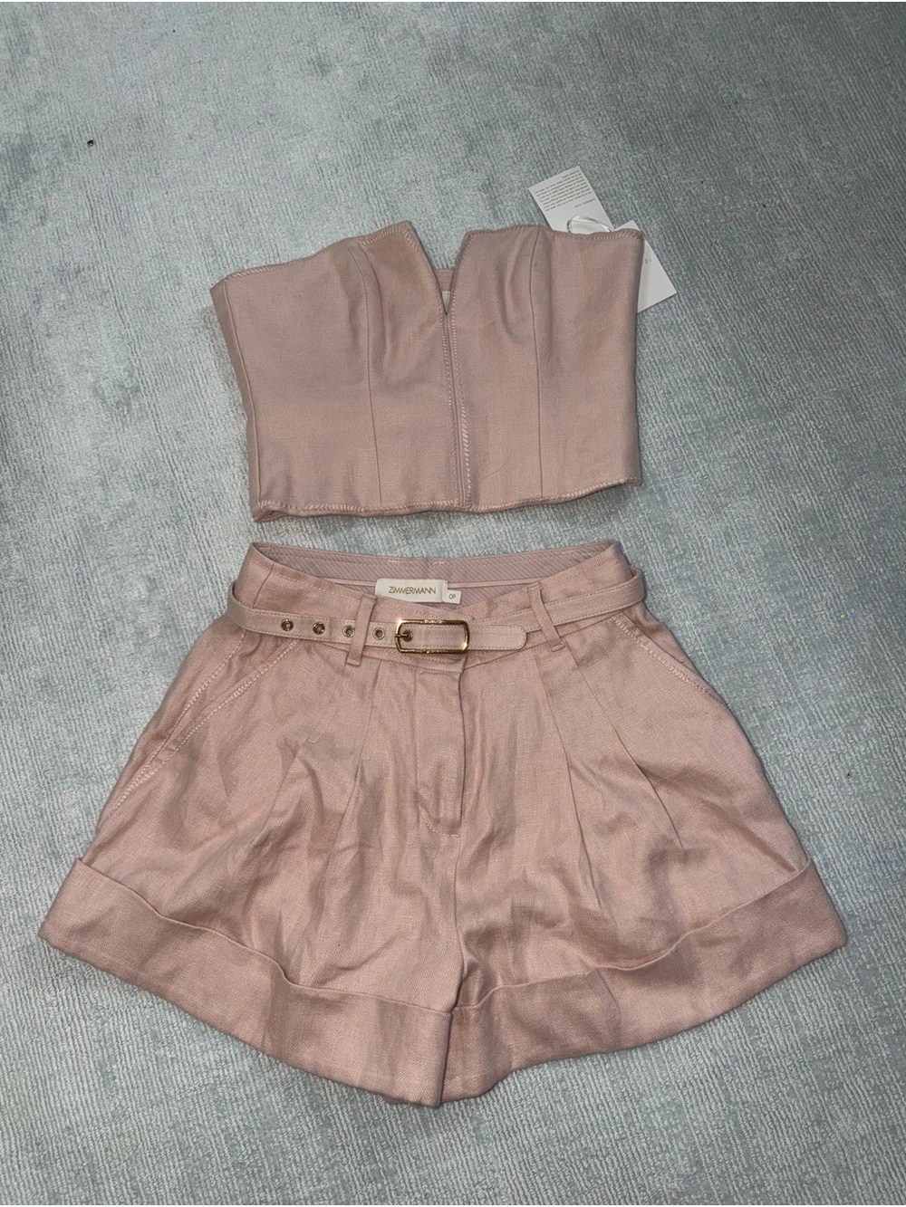 Zimmermann Blush Pink High-Waist Pleated Belted Shorts with matching top.